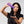 Woman holding a purple Foligain product against a gray background